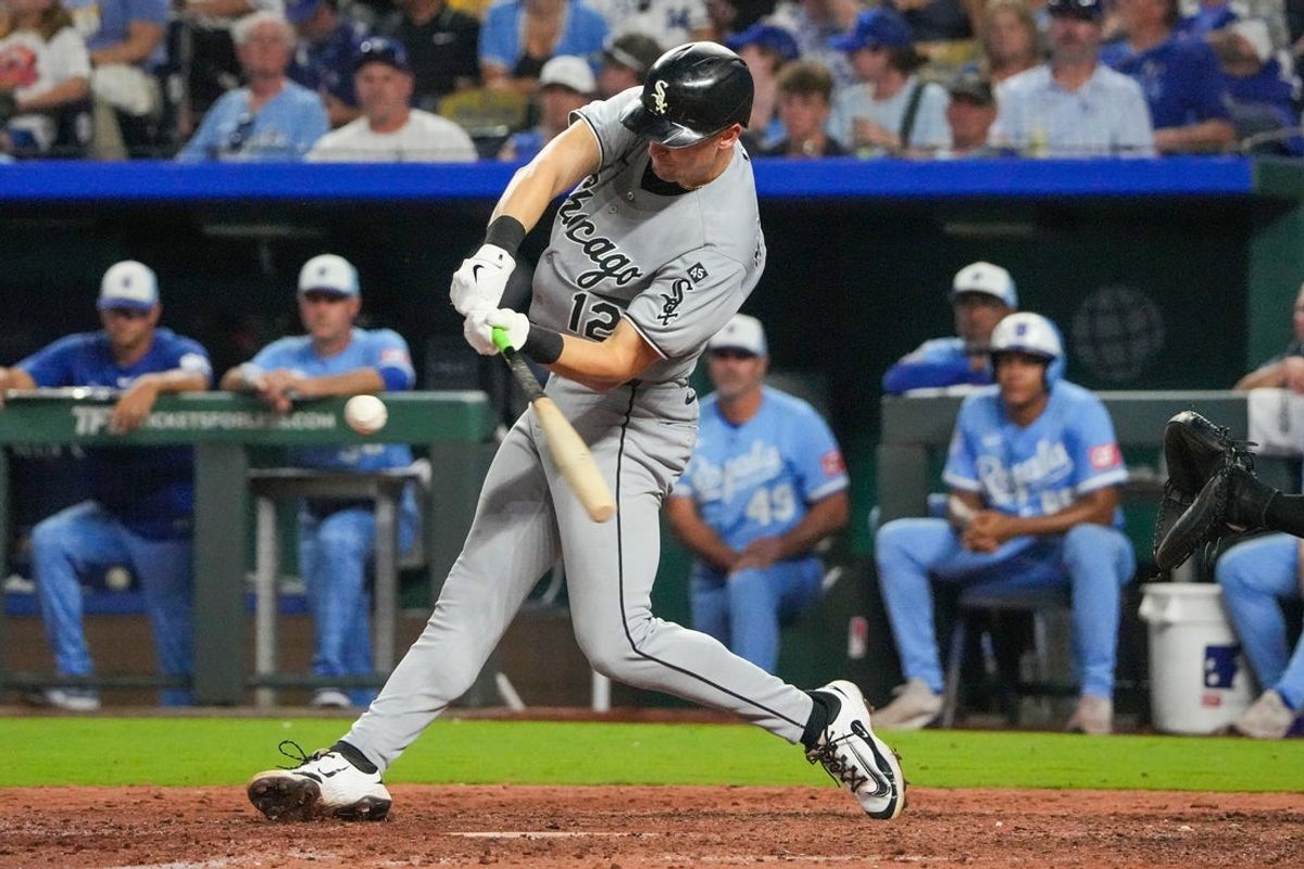 Aug 16, 2025; Kansas City, Missouri, USA; Chicago White Sox shortstop Colson Montgomery (12) hits a double against the Kansas City Royals in the eighth inning at Kauffman Stadium. Mandatory Credit: Denny Medley-Imagn Images