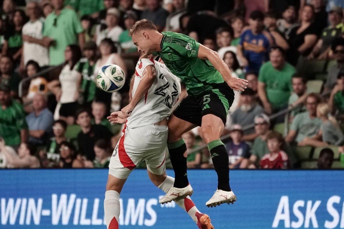 Aug 16, 2025; Austin, Texas, USA; Austin FC defender Oleksandr Svatok (5) and FC Dallas forward Logan Farrington (23) header the ball during the second half of the game at Q2 Stadium. Mandatory Credit: Dustin Safranek-Imagn Images