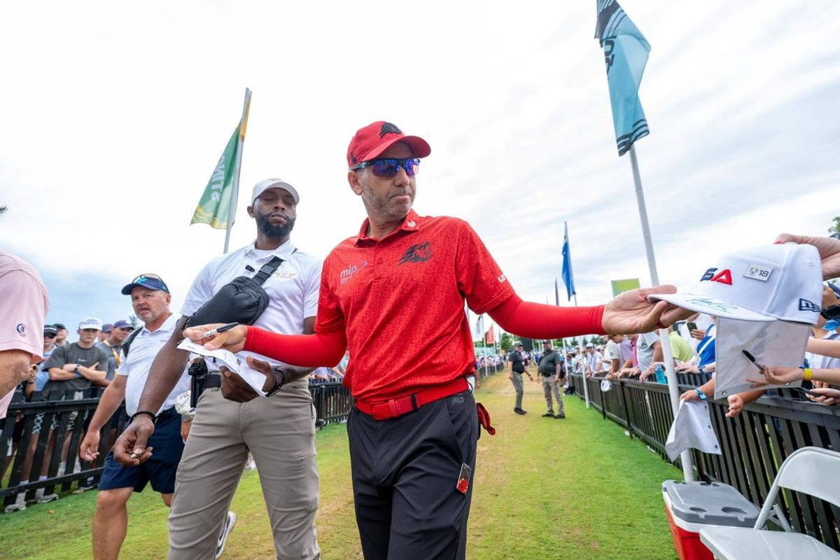 Aug 17, 2025; Indianapolis,IN, United States; Sergio Garcia of Fireballs GC signs an autograph before the final round of LIV Golf Indianapolis. Mandatory Credit: Marc Lebryk-Imagn Images