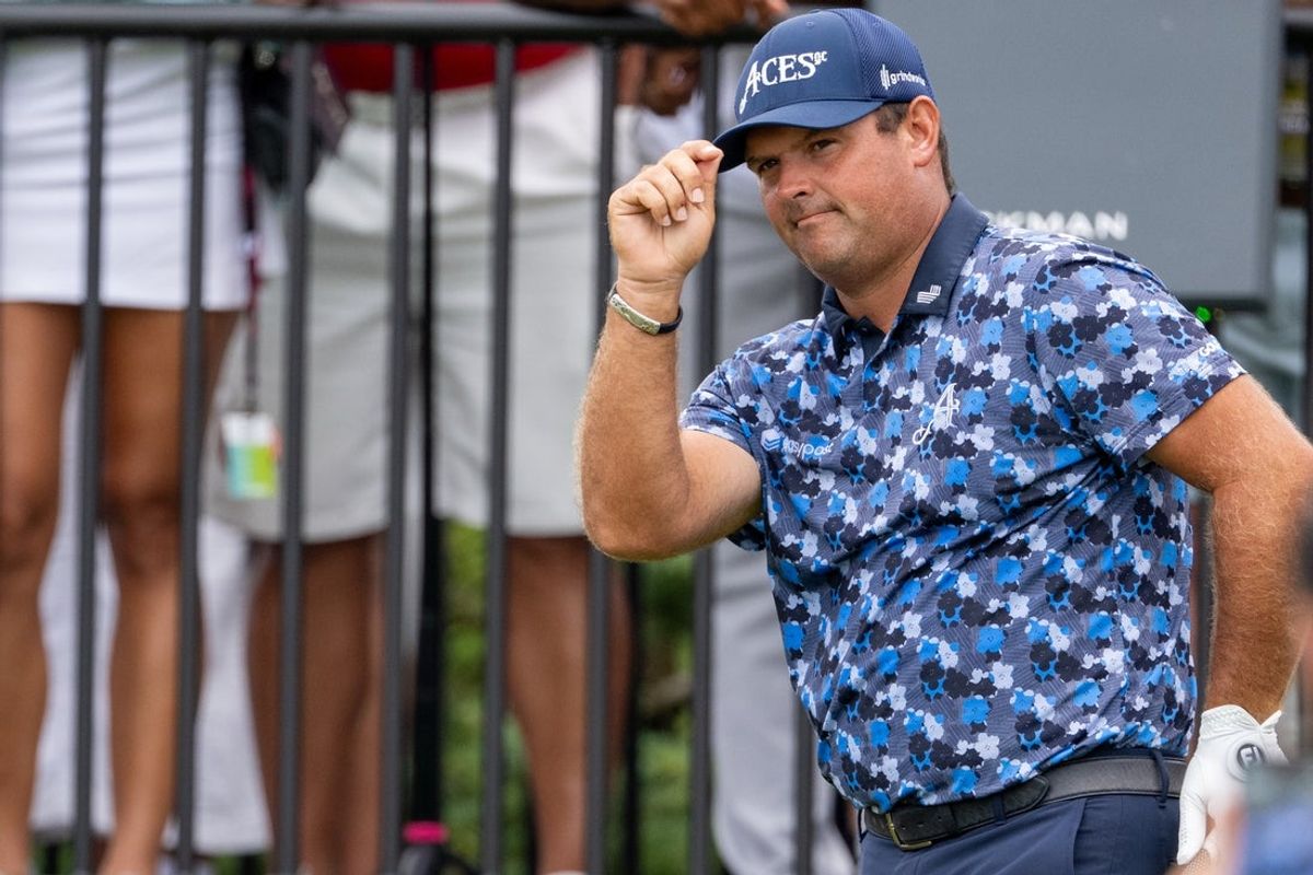 Aug 17, 2025; Indianapolis,IN, United States;  Patrick Reed of 4 Aces GC tips his hat to the crowd after being announced during the final round of LIV Golf Indianapolis. Mandatory Credit: Marc Lebryk-Imagn Images