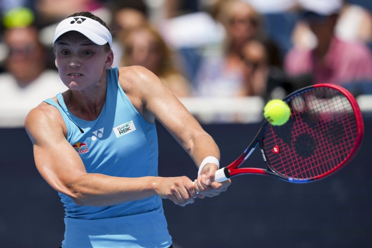 Aug 17, 2025; Cincinnati, OH, USA;  Elena Rybakina (KAZ) returns a shot against Iga Swiatek (POL) during the Cincinnati Open at the Lindner Family Tennis Center. Mandatory Credit: Aaron Doster-Imagn Images