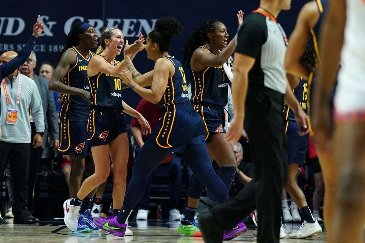 Aug 17, 2025; Uncasville, Connecticut, USA; The Indiana Fever celebrate their overtime win against the Connecticut Sun at Mohegan Sun Arena. Mandatory Credit: David Butler II-Imagn Images