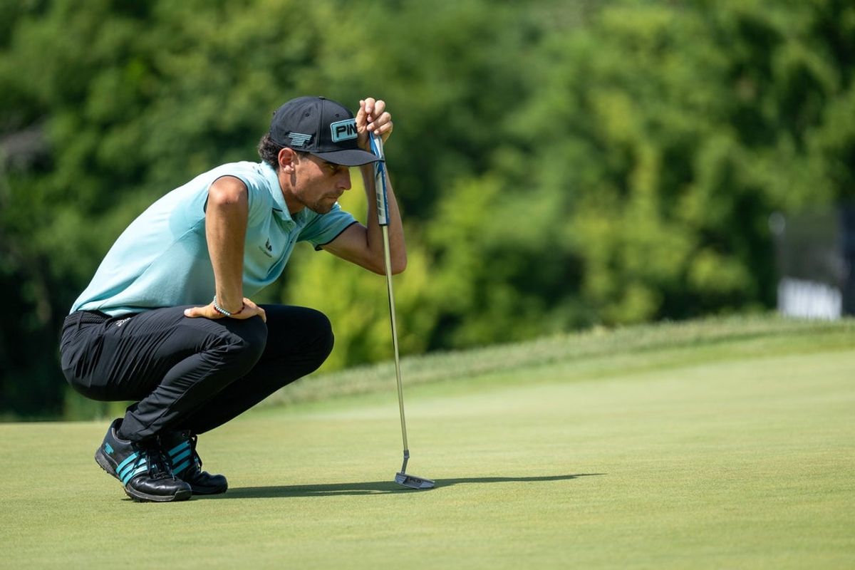 Aug 17, 2025; Indianapolis,IN, United States; Joaquin Niemann of Torque GC lines up his putt on the 18th green during the final round of LIV Golf Indianapolis. Mandatory Credit: Marc Lebryk-Imagn Images