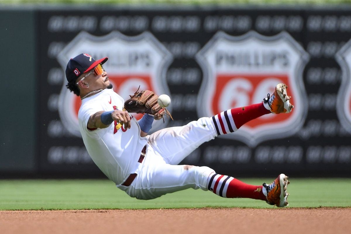 Aug 17, 2025; St. Louis, Missouri, USA;  St. Louis Cardinals shortstop Masyn Winn (0) throws from his knees to force out New York Yankees center fielder Trent Grisham (not pictured) during the first inning at Busch Stadium. Mandatory Credit: Jeff Curry-Imagn Images
