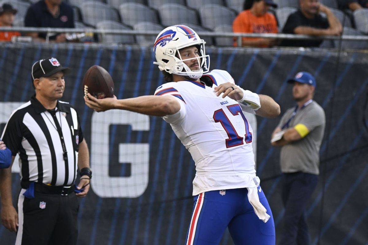 Aug 17, 2025; Chicago, Illinois, USA;  Buffalo Bills quarterback Josh Allen (17) during warmups before a preseason game against the Chicago Bears at Soldier Field. Mandatory Credit: Matt Marton-Imagn Images