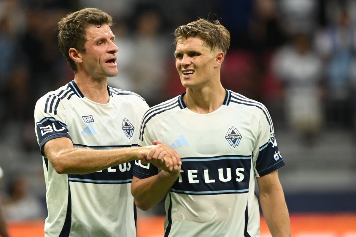 Aug 17, 2025; Vancouver, British Columbia, CAN;  Vancouver Whitecaps FC midfielder Thomas Muller (13) and defender Bjorn Inge Utvik (15) react post game against the Houston Dynamo at BC Place. Mandatory Credit: Anne-Marie Sorvin-Imagn Images