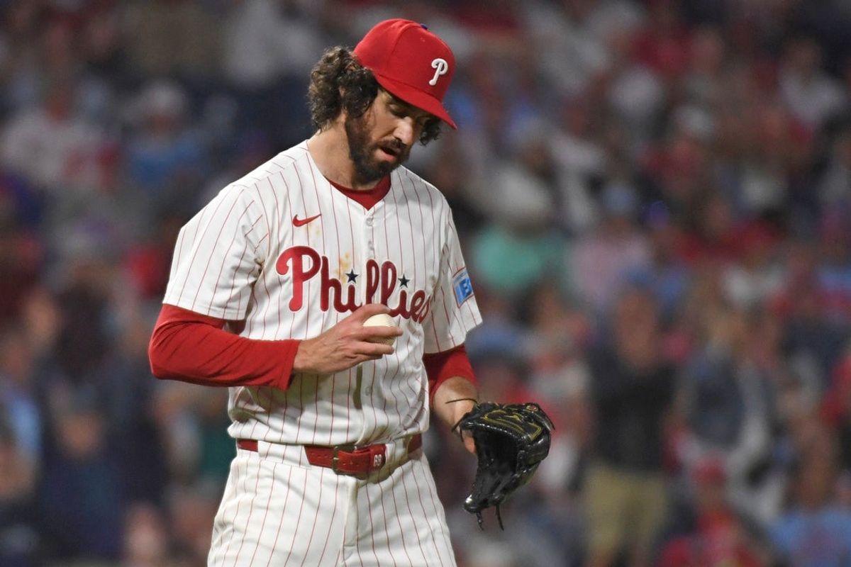 Aug 18, 2025; Philadelphia, Pennsylvania, USA;  Philadelphia Phillies pitcher Jordan Romano (68) gets a new baseball after allowing a home run during the seventh inning against the Seattle Mariners at Citizens Bank Park. Mandatory Credit: Eric Hartline-Imagn Images