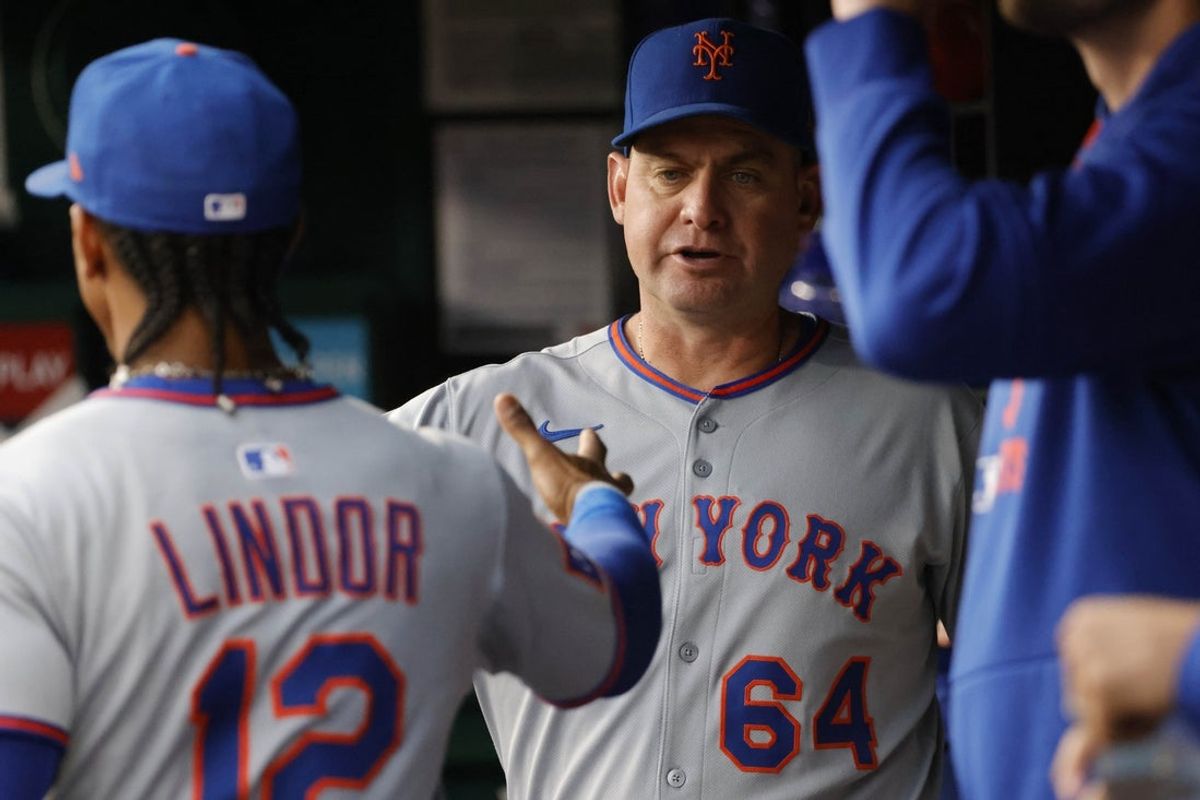 Aug 19, 2025; Washington, District of Columbia, USA; New York Mets manager Carlos Mendoza (64) greets New York Mets shortstop Francisco Lindor (12) in the dugout prior to their game against the Washington Nationals prior to their game at Nationals Park. Mandatory Credit: Amber Searls-Imagn Images