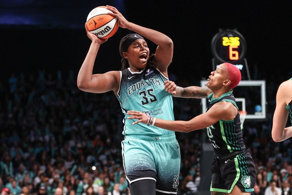 Aug 19, 2025; Brooklyn, New York, USA;  New York Liberty center Jonquel Jones (35) is guarded by Minnesota Lynx guard Courtney Williams (10) in the fourth quarter at Barclays Center. Mandatory Credit: Wendell Cruz-Imagn Images