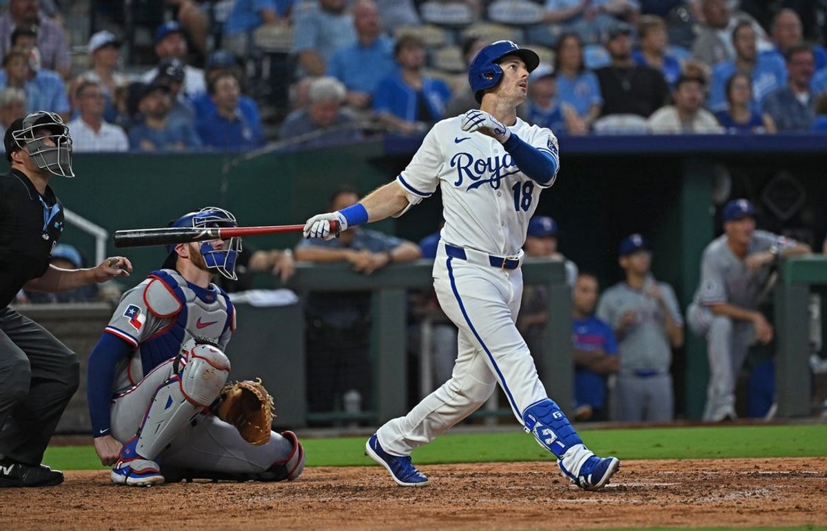 Aug 19, 2025; Kansas City, Missouri, USA;  Kansas City Royals right fielder Mike Yastrzemski (18) hits a solo home run in the sixth inning against the Texas Rangers at Kauffman Stadium. Mandatory Credit: Peter Aiken-Imagn Images