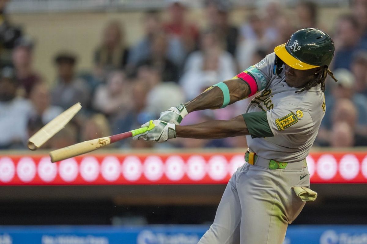 Aug 19, 2025; Minneapolis, Minnesota, USA; Athletics center fielder Lawrence Butler (4) breaks his bat during an at bat against the Minnesota Twins in the fifth inning at Target Field. Mandatory Credit: Jesse Johnson-Imagn Images