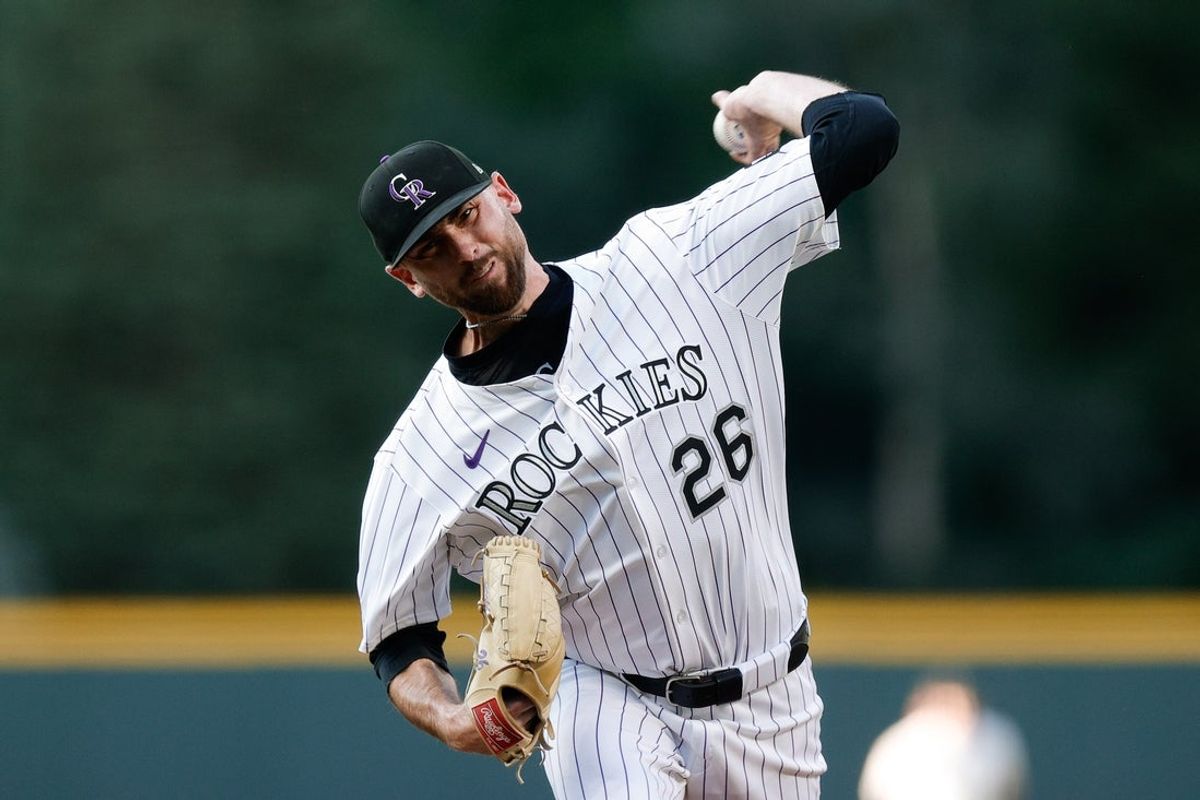 Aug 19, 2025; Denver, Colorado, USA; Colorado Rockies starting pitcher Austin Gomber (26) pitches in the first inning against the Los Angeles Dodgers at Coors Field. Mandatory Credit: Isaiah J. Downing-Imagn Images