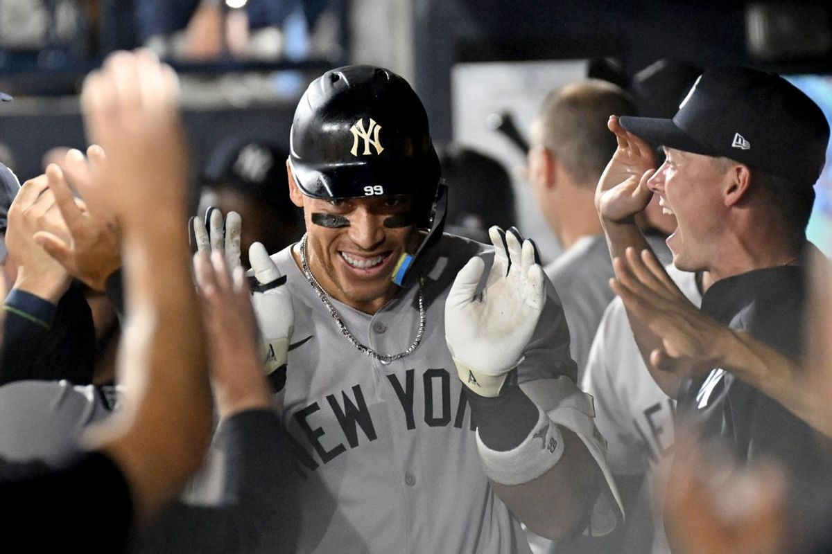 Aug 19, 2025; St. Petersburg, Florida, USA; New York Yankees designated hitter Aaron Judge (99) celebrates in the dugout after hitting a solo home run in the first inning against the Tampa Bay Rays  at George M. Steinbrenner Field. Mandatory Credit: Jonathan Dyer-Imagn Images