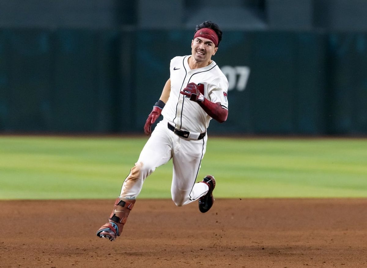 Aug 19, 2025; Phoenix, Arizona, USA; Arizona Diamondbacks outfielder Corbin Carroll runs to third after hitting an RBI triple in the fifth inning against the Cleveland Guardians at Chase Field. Mandatory Credit: Mark J. Rebilas-Imagn Images