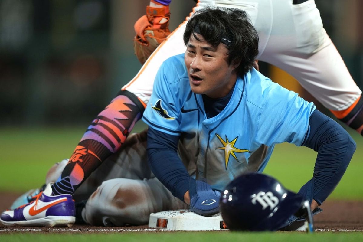 Aug 16, 2025; San Francisco, California, USA; Tampa Bay Rays shortstop Ha-Seong Kim (7) reacts after being tagged out at third base during the ninth inning against the San Francisco Giants at Oracle Park. Mandatory Credit: Darren Yamashita-Imagn Images