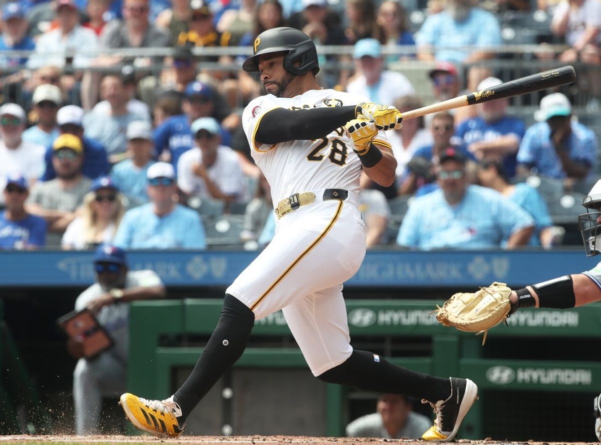 Aug 20, 2025; Pittsburgh, Pennsylvania, USA;  Pittsburgh Pirates left fielder Tommy Pham (28) hits a two-run double against the Toronto Blue Jays during the first inning at PNC Park. Mandatory Credit: Charles LeClaire-Imagn Images