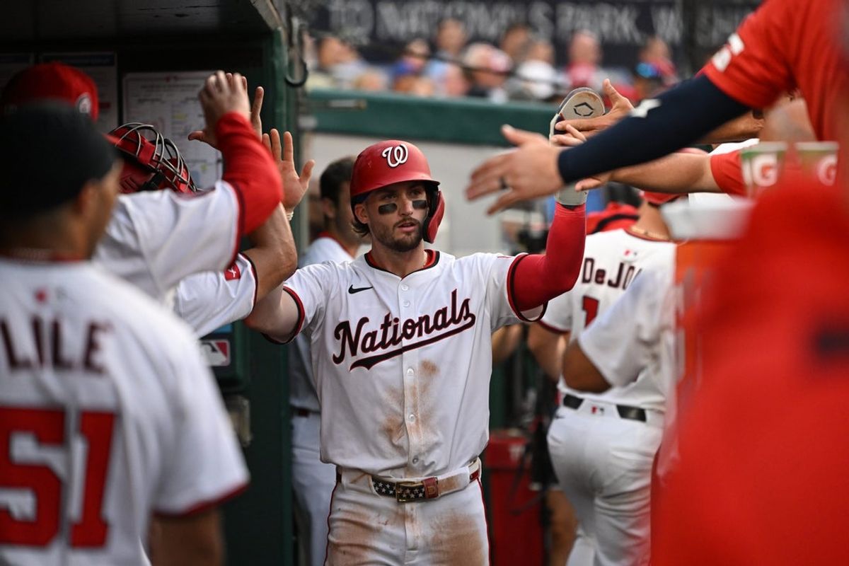 Aug 20, 2025; Washington, District of Columbia, USA; Washington Nationals right fielder Dylan Crews (3) celebrates in the dugout after scoring a run against the New York Mets during the third inning at Nationals Park. Mandatory Credit: Rafael Suanes-Imagn Images