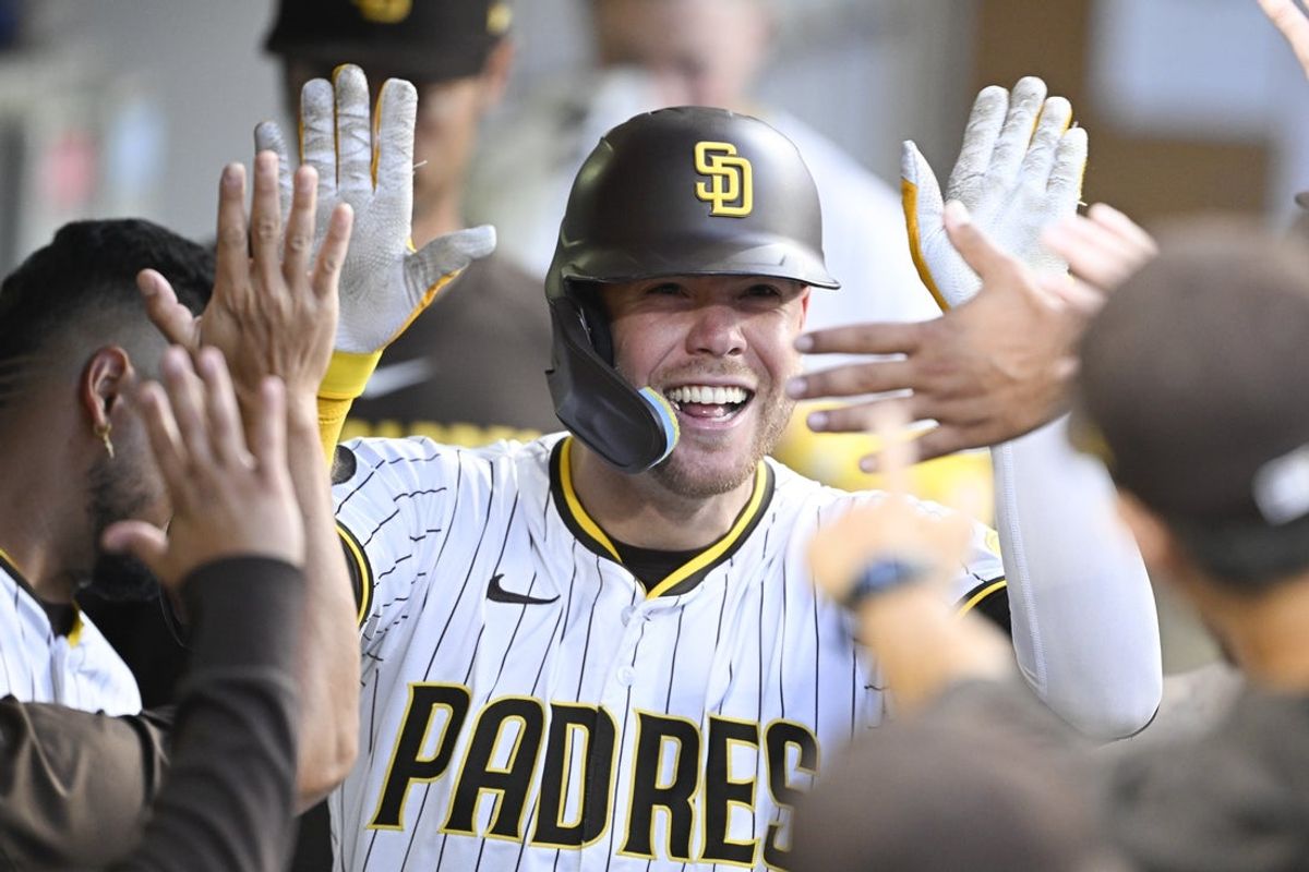 Aug 20, 2025; San Diego, California, USA; San Diego Padres left fielder Gavin Sheets (30) is congratulated after hitting a solo home run during the second inning against the San Francisco Giants at Petco Park. Mandatory Credit: Denis Poroy-Imagn Images