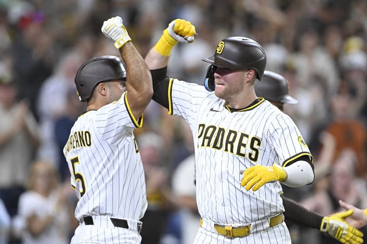 Aug 20, 2025; San Diego, California, USA; San Diego Padres left fielder Gavin Sheets (30) is congratulated by Ramon Laureano (5) after hitting a three-run home run during the third inning against the San Francisco Giants at Petco Park. Mandatory Credit: Denis Poroy-Imagn Images