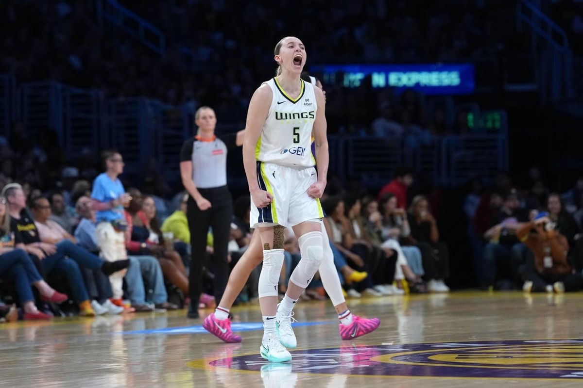 Aug 20, 2025; Los Angeles, California, USA; Dallas Wings guard Paige Bueckers (5) celebrates in the second half against the LA Sparks at Crypto.com Arena. Mandatory Credit: Kirby Lee-Imagn Images