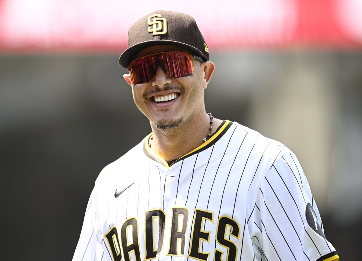 Aug 21, 2025; San Diego, California, USA; San Diego Padres third baseman Manny Machado (13) smiles as he leaves the field during the second inning against the San Francisco Giants at Petco Park. Mandatory Credit: Denis Poroy-Imagn Images