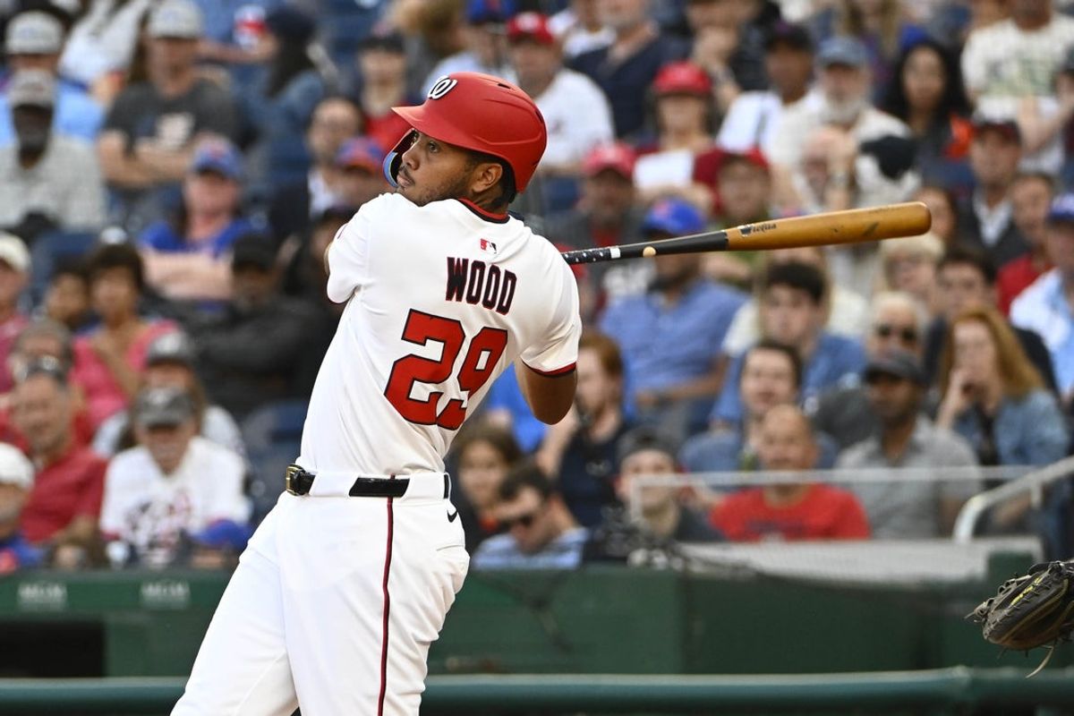 Aug 21, 2025; Washington, District of Columbia, USA; Washington Nationals designated hits a three run home run against the New York Mets during the eighth inning James Wood (29) hit at Nationals Park. Mandatory Credit: Brad Mills-Imagn Images
