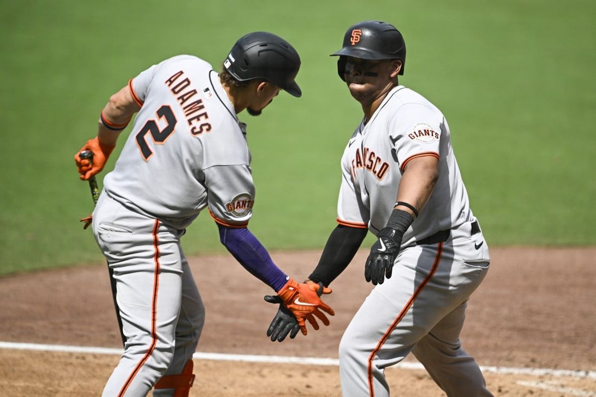 Aug 21, 2025; San Diego, California, USA; San Francisco Giants designated hitter Rafael Devers (16) is congratulated by San Francisco Giants shortstop Willy Adames (2) after hitting a solo home run during the sixth inning against the San Diego Padres at Petco Park. Mandatory Credit: Denis Poroy-Imagn Images
