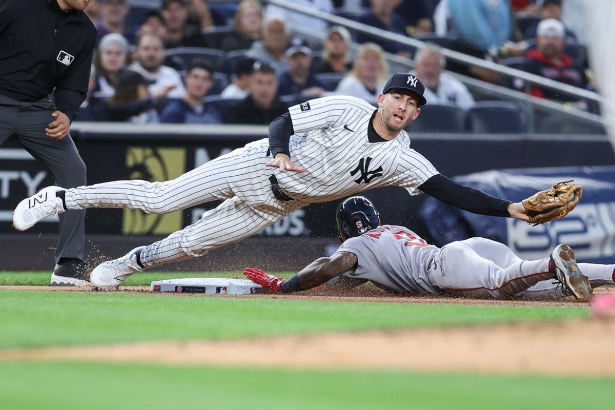 Aug 21, 2025; Bronx, New York, USA;  Boston Red Sox center fielder Ceddanne Rafaela (3) slides past New York Yankees third baseman Ryan McMahon (19) for a stolen base in the second inning at Yankee Stadium. Mandatory Credit: Wendell Cruz-Imagn Images