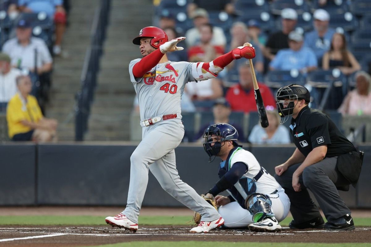 Aug 21, 2025; Tampa, Florida, USA; St. Louis Cardinals first baseman Willson Contreras (40) singles against the Tampa Bay Rays in the first inning at George M. Steinbrenner Field. Mandatory Credit: Nathan Ray Seebeck-Imagn Images