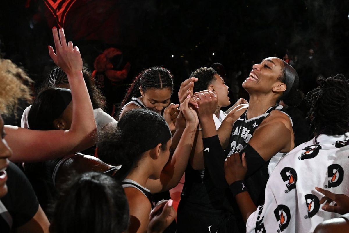 Aug 21, 2025; Las Vegas, Nevada, USA; Las Vegas Aces center A'ja Wilson (22) and teammates celebrate defeating the Phoenix Mercury at Michelob Ultra Arena. Mandatory Credit: Candice Ward-Imagn Images