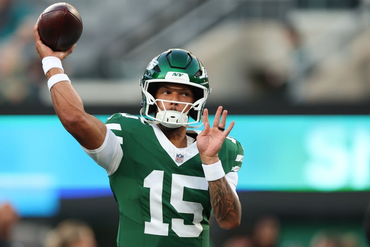 Aug 22, 2025; East Rutherford, New Jersey, USA; New York Jets quarterback Adrian Martinez (15) warms up before the preseason game against the Philadelphia Eagles at MetLife Stadium. Mandatory Credit: Vincent Carchietta-Imagn Images