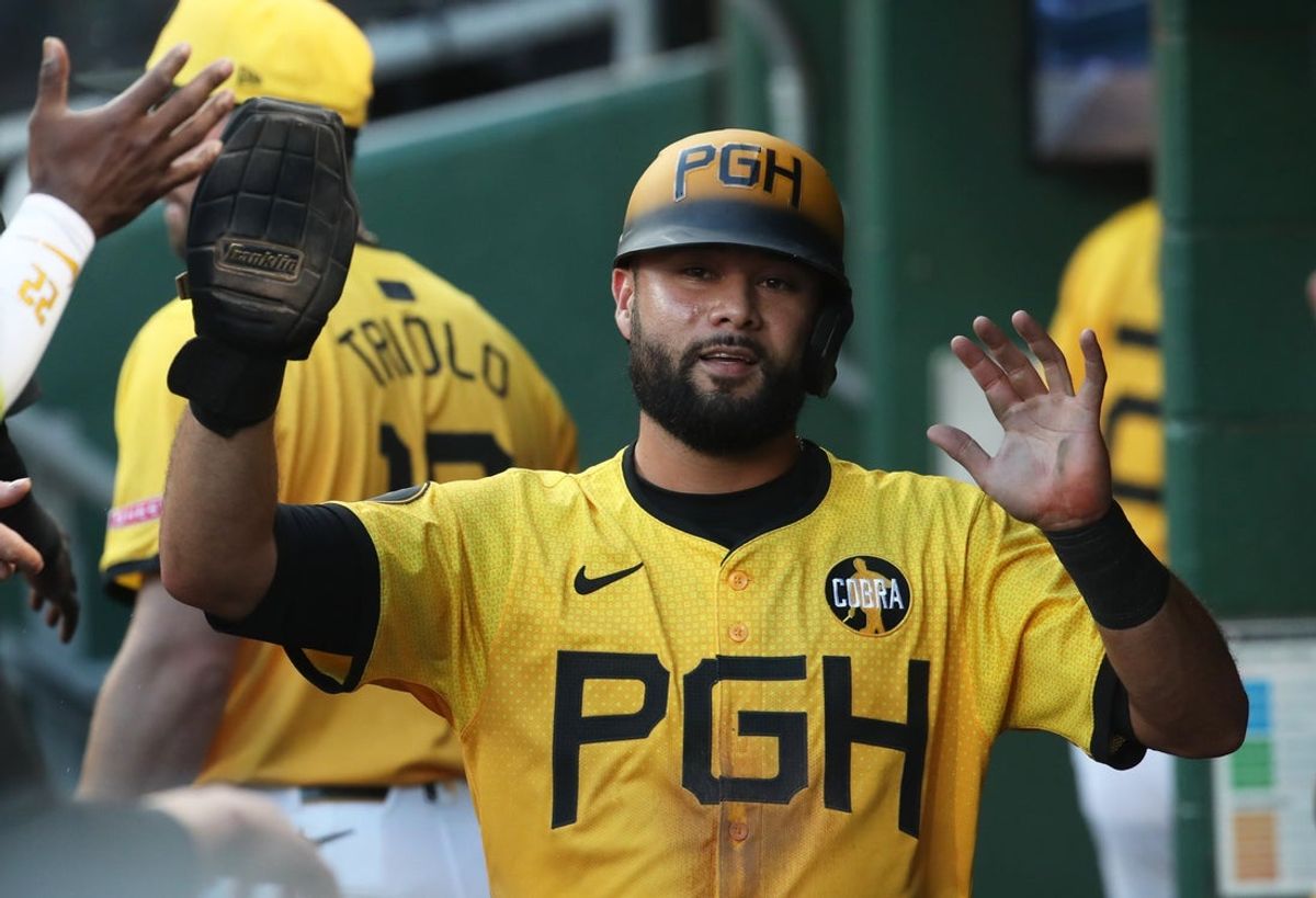 Aug 22, 2025; Pittsburgh, Pennsylvania, USA; Pittsburgh Pirates third baseman Isiah Kiner-Falefa (7) celebrates in the dugout after scoring a run against the Colorado Rockies during the second inning at PNC Park. Mandatory Credit: Charles LeClaire-Imagn Images