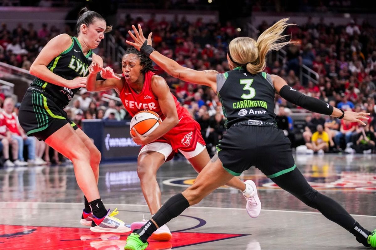 Indiana Fever guard Kelsey Mitchell (0) moves past Minnesota Lynx forward Bridget Carleton (6) and Minnesota Lynx guard DiJonai Carrington (3) on Friday, Aug. 22, 2025, during a game between the Indiana Fever and the Minnesota Lynx at Gainbridge Fieldhouse in Indianapolis.