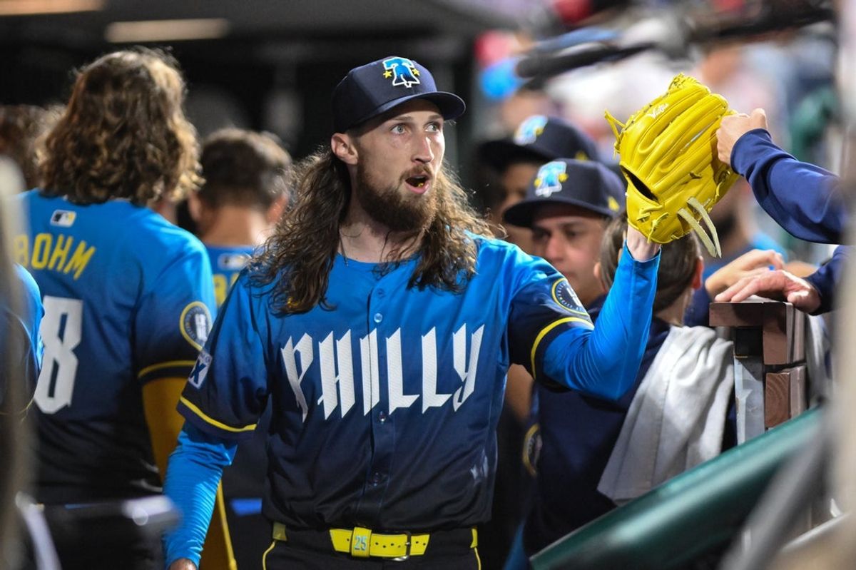 Aug 22, 2025; Philadelphia, Pennsylvania, USA; Philadelphia Phillies pitcher Matt Strahm (25) is greeted by teammates in the dugout after the seventh inning against the Washington Nationals at Citizens Bank Park. Mandatory Credit: John Jones-Imagn Images