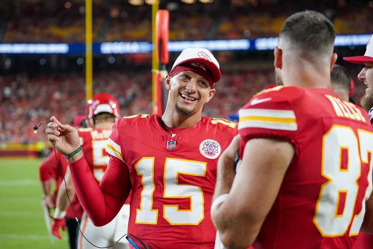 Aug 22, 2025; Kansas City, Missouri, USA; Kansas City Chiefs quarterback Patrick Mahomes (15) talks with tight end Travis Kelce (87) on  the sidelines against the Chicago Bears during the first half of the game at GEHA Field at Arrowhead Stadium. Mandatory Credit: Denny Medley-Imagn Images