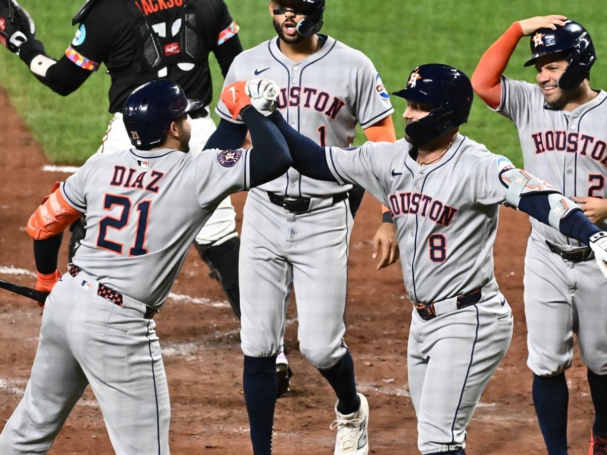 Aug 22, 2025; Baltimore, Maryland, USA;  Houston Astros first baseman Christian Walker (8) celebrates with catcher Yainer Diaz (21) after hitting a three-run home run during the fifth inning against the Baltimore Orioles at Oriole Park at Camden Yards. Mandatory Credit: James A. Pittman-Imagn Images