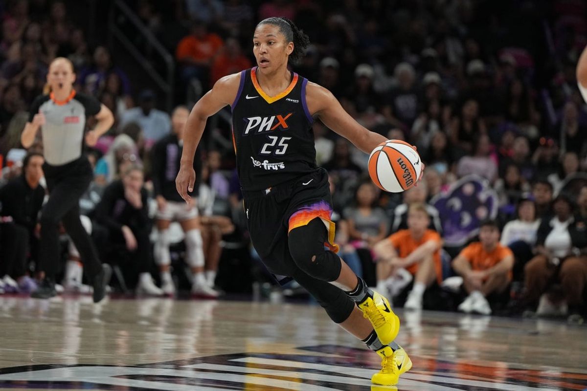 Aug 22, 2025; Phoenix, Arizona, USA; Phoenix Mercury forward Alyssa Thomas (25) drives on the Golden State Valkyries in the second half at Footprint Center. Mandatory Credit: Rick Scuteri-Imagn Images