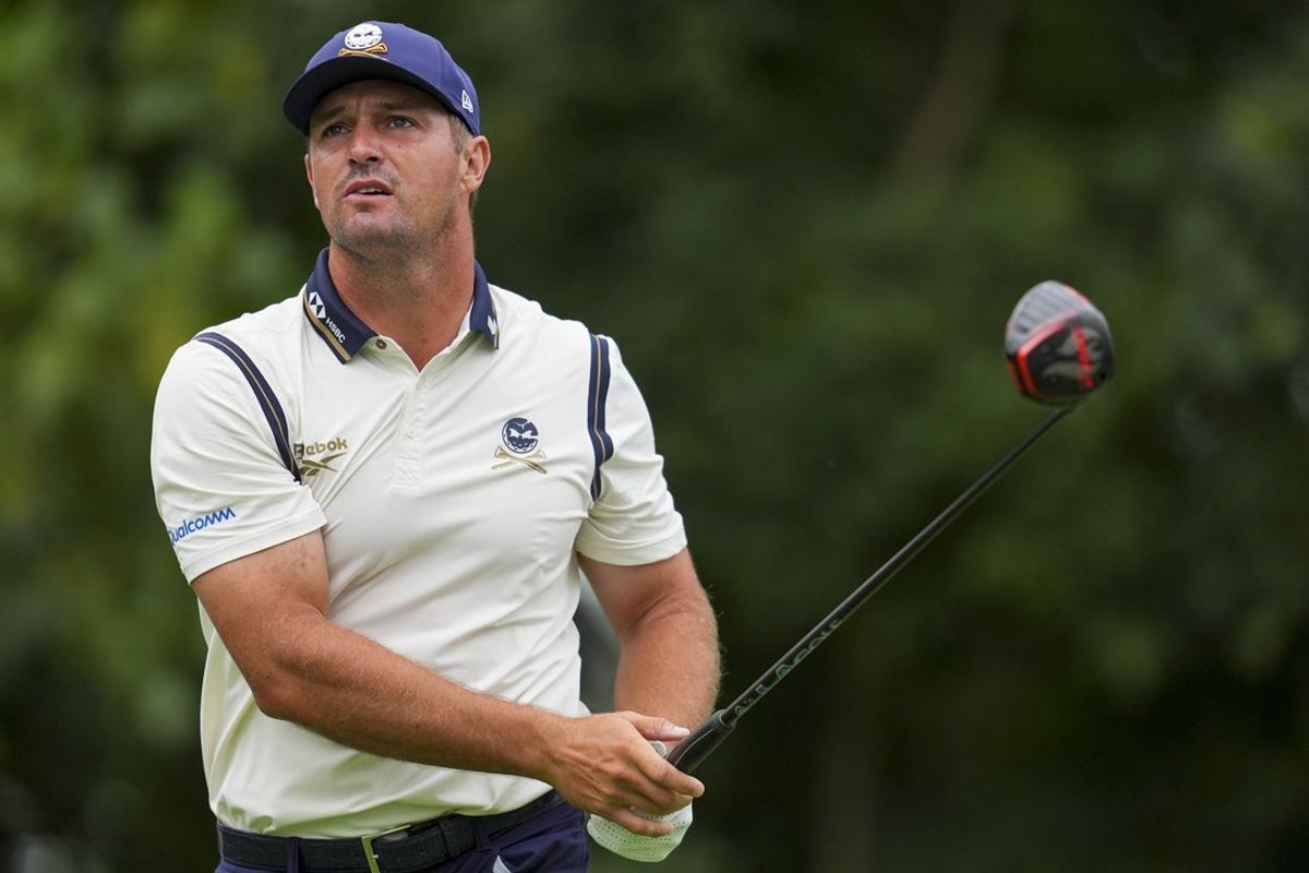 Aug 23, 2025; Detroit, Michigan, USA;  Bryson DeChambeau of Crushers GC plays his shot from the seventh tee during the semifinals of the LIV Golf Michigan Team Championship at The Cardinal at Saint John's Resort. Mandatory Credit: Aaron Doster-Imagn Images
