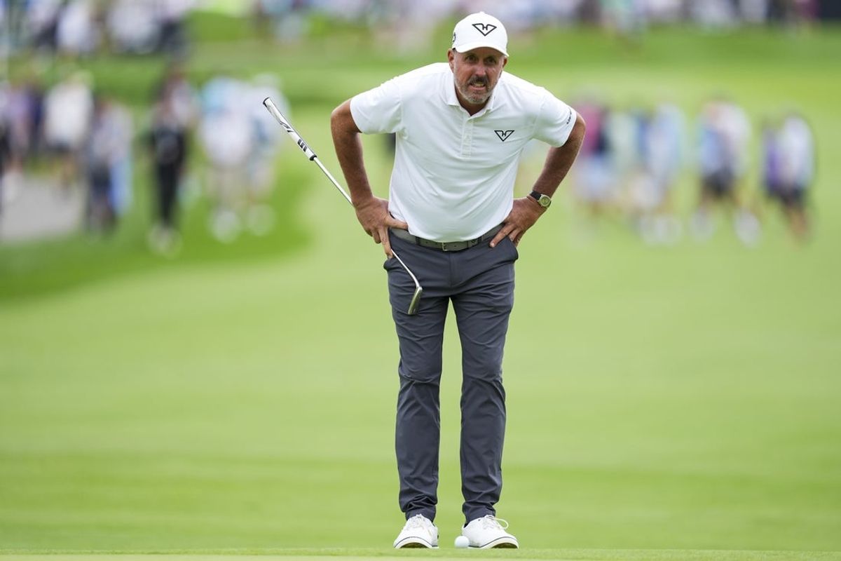 Aug 23, 2025; Detroit, Michigan, USA;  Phil Mickelson of HyFlyers GC lines up a putt on the first green during the semifinals of the LIV Golf Michigan Team Championship at The Cardinal at Saint John's Resort. Mandatory Credit: Aaron Doster-Imagn Images