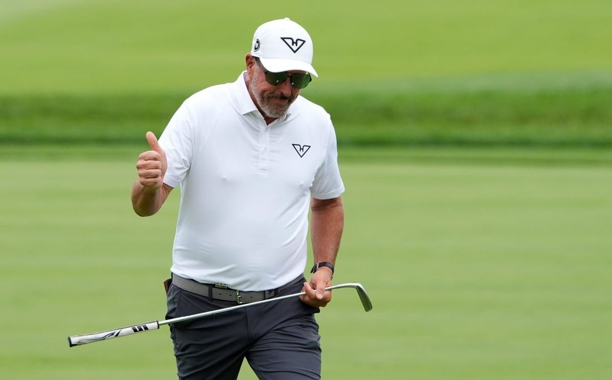Phil Mickelson of Team HyFlyers GC reacts to the cheers of his fans as he walks up to the fourth green during the LIV Golf Michigan Team Championship semifinals at The Cardinal at St. John’s in Plymouth on Saturday, August 23, 2025.