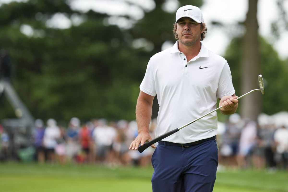 Aug 23, 2025; Detroit, Michigan, USA;  Brooks Koepka of Smash GC lines up a putt on the 17th green during the semifinals of the LIV Golf Michigan Team Championship at The Cardinal at Saint John's Resort. Mandatory Credit: Aaron Doster-Imagn Images
