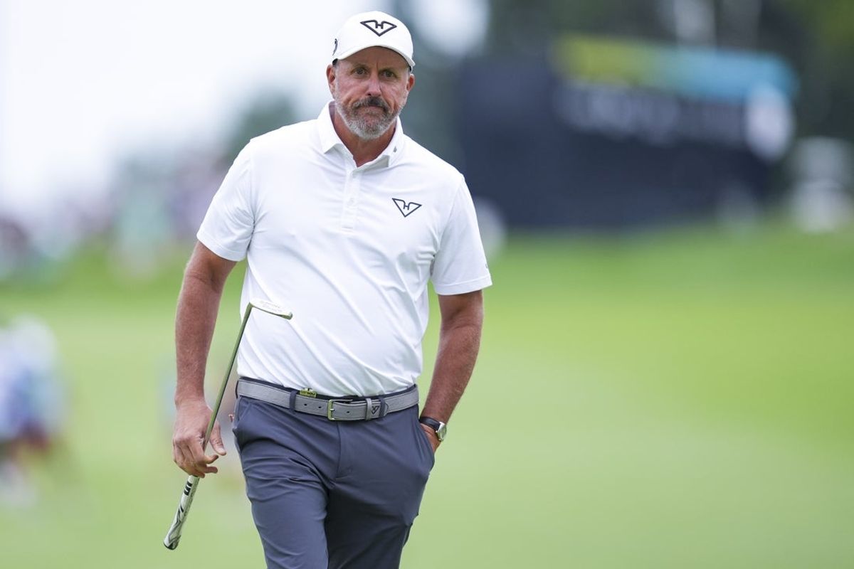Aug 23, 2025; Detroit, Michigan, USA;  Phil Mickelson of HyFlyers GC walks on the first green during the semifinals of the LIV Golf Michigan Team Championship at The Cardinal at Saint John's Resort. Mandatory Credit: Aaron Doster-Imagn Images