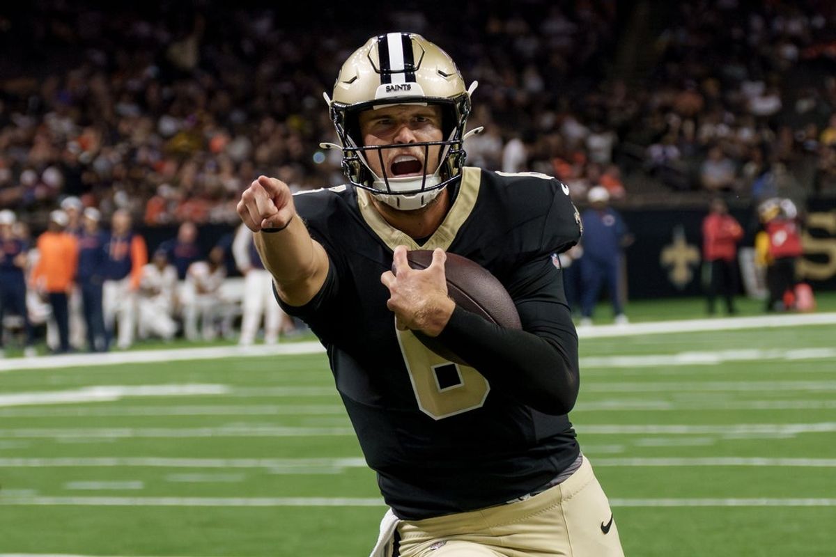 Aug 23, 2025; New Orleans, Louisiana, USA; New Orleans Saints quarterback Tyler Shough (6) runs in for a touchdown against Denver Broncos linebacker Andrew Farmer (53) during the fourth quarter at Caesars Superdome. Mandatory Credit: Matthew Hinton-Imagn Images