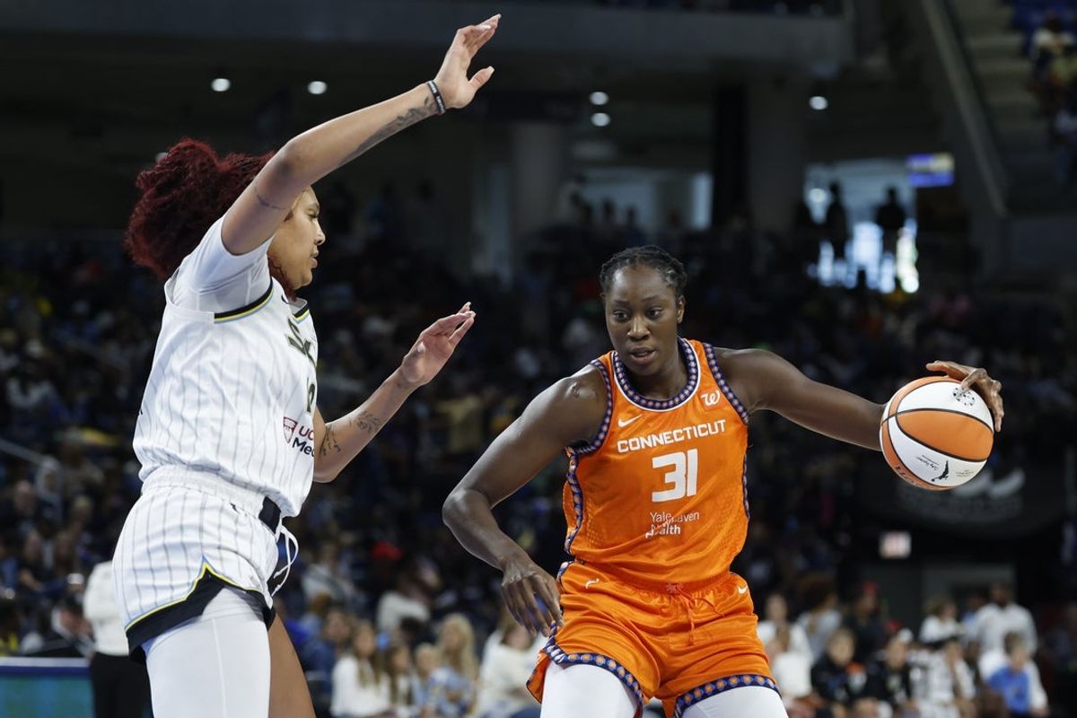 Aug 23, 2025; Chicago, Illinois, USA; Connecticut Sun center Tina Charles (31) drives to the basket against Chicago Sky center Kamilla Cardoso (10) during the first half at Wintrust Arena. Mandatory Credit: Kamil Krzaczynski-Imagn Images