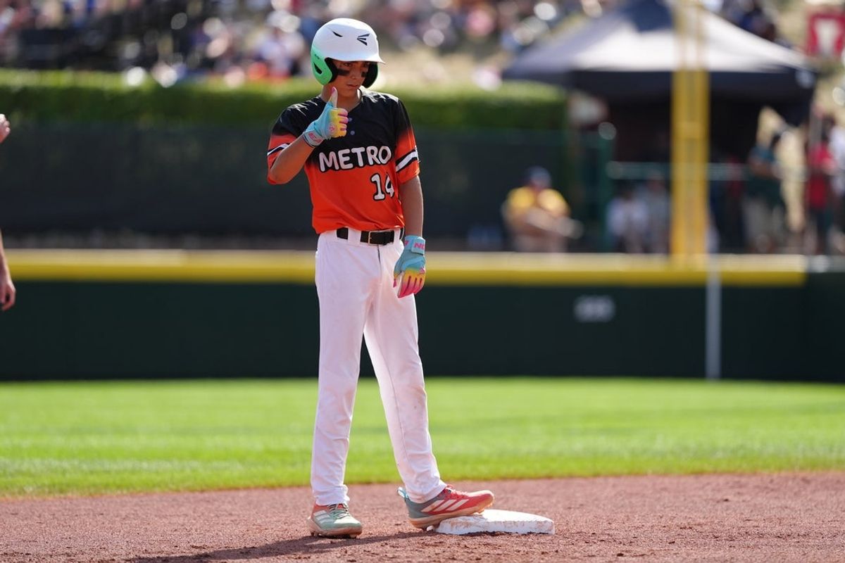 Aug 23, 2025; Williamsport, PA, USA; SJ Taxiltaridis (14) of Metro Region reacts against Mountain Region in the first inning at Howard J. Lamade Stadium. Mandatory Credit: Kyle Ross-Imagn Images