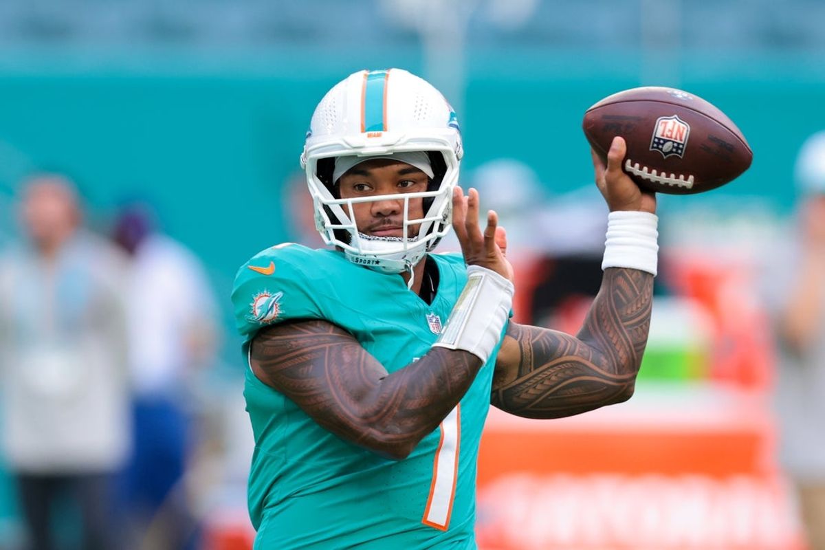 Aug 23, 2025; Miami Gardens, Florida, USA; Miami Dolphins quarterback Tua Tagovailoa (1) throws the football before the game against the Jacksonville Jaguars at Hard Rock Stadium. Mandatory Credit: Sam Navarro-Imagn Images