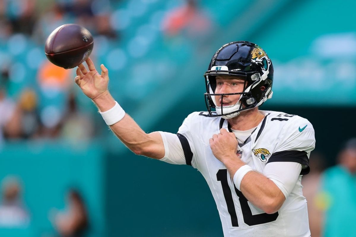 Aug 23, 2025; Miami Gardens, Florida, USA; Jacksonville Jaguars quarterback John Wolford (18) throws the football against the Miami Dolphins during the first quarter at Hard Rock Stadium. Mandatory Credit: Sam Navarro-Imagn Images