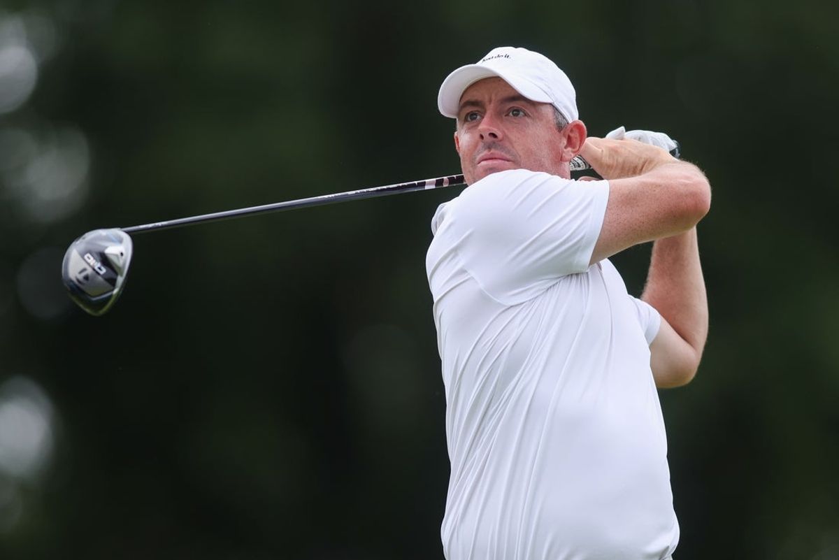 Aug 23, 2025; Atlanta, Georgia, USA; Rory McIlroy plays his shot from the 18th tee during the third round of the TOUR Championship golf tournament. Mandatory Credit: Brett Davis-Imagn Images