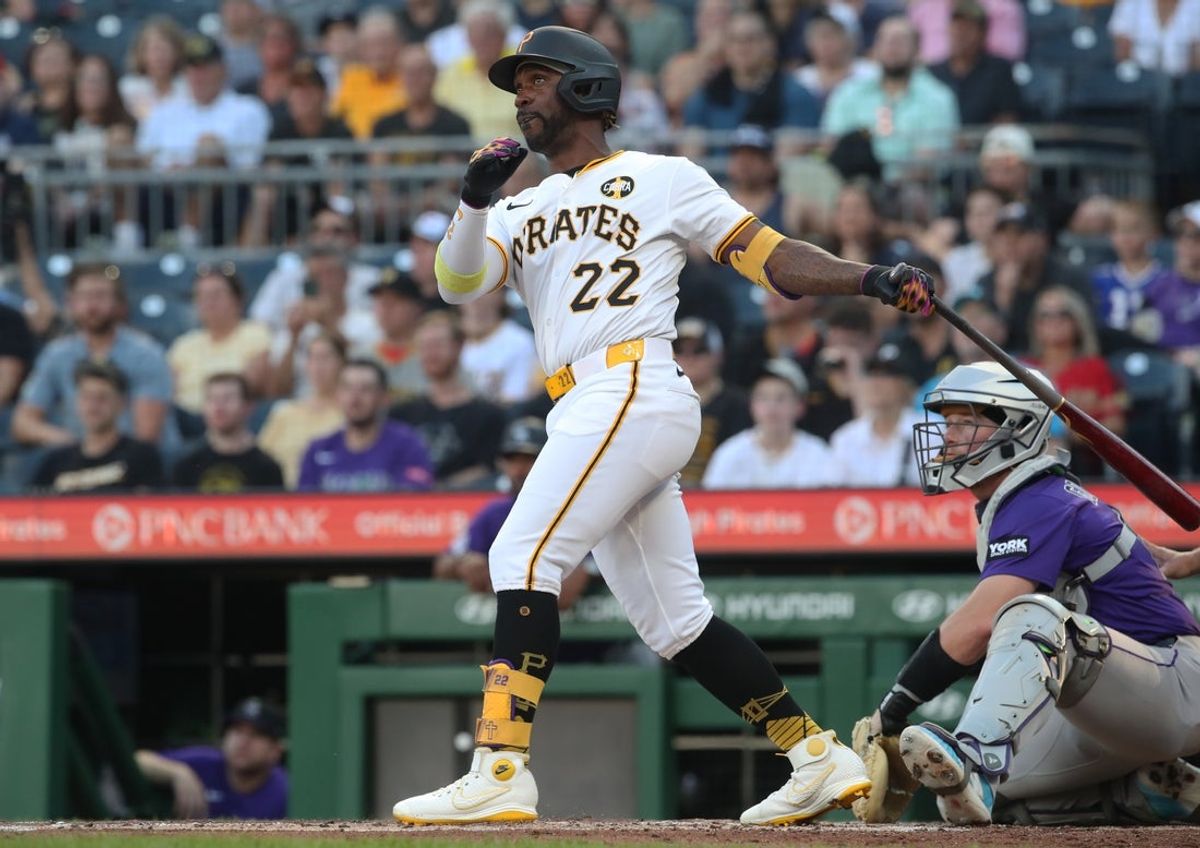 Aug 23, 2025; Pittsburgh, Pennsylvania, USA;  Pittsburgh Pirates designated hitter Andrew McCutchen (22) hits a two run home run against the Colorado Rockies during the second inning at PNC Park. Mandatory Credit: Charles LeClaire-Imagn Images