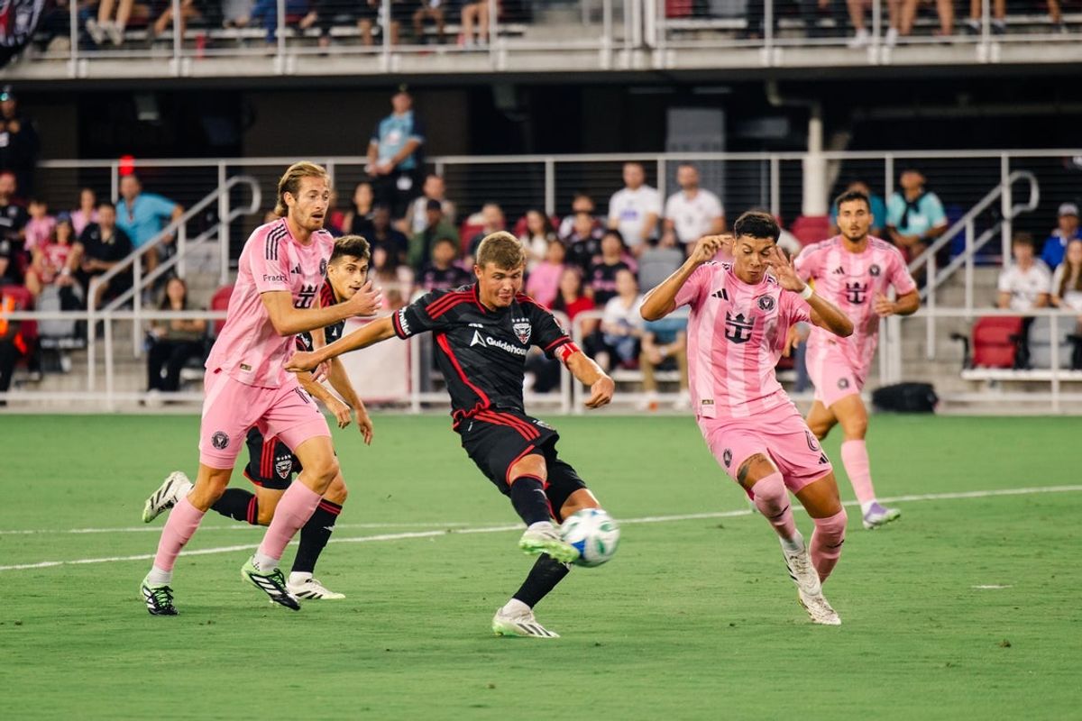 Aug 23, 2025; Washington, District of Columbia, USA; D.C. United midfielder Jackson Hopkins (25) shoots the ball for a goal while Inter Miami midfielder Tomas Aviles (6) and defender Ryan Sailor (15) defend in the first half at Audi Field. Mandatory Credit: Emily Faith Morgan-Imagn Images